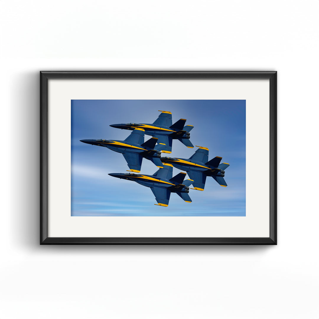 This high-resolution fine art print features the Blue Angels Navy jets in tight formation, captured during a precision air show. Ideal for aviation enthusiasts and military decor collectors, this aircraft wall art makes a bold statement in any home, office, or pilot-inspired space